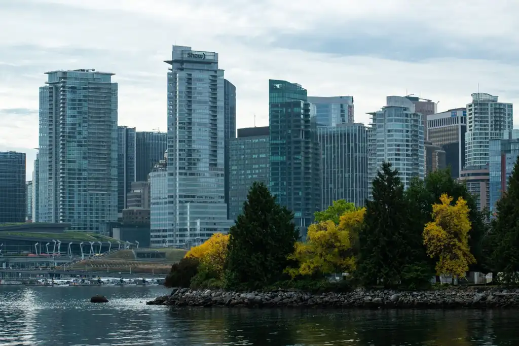 Vancouver downtown landscape framed by autumn waterfront reflections