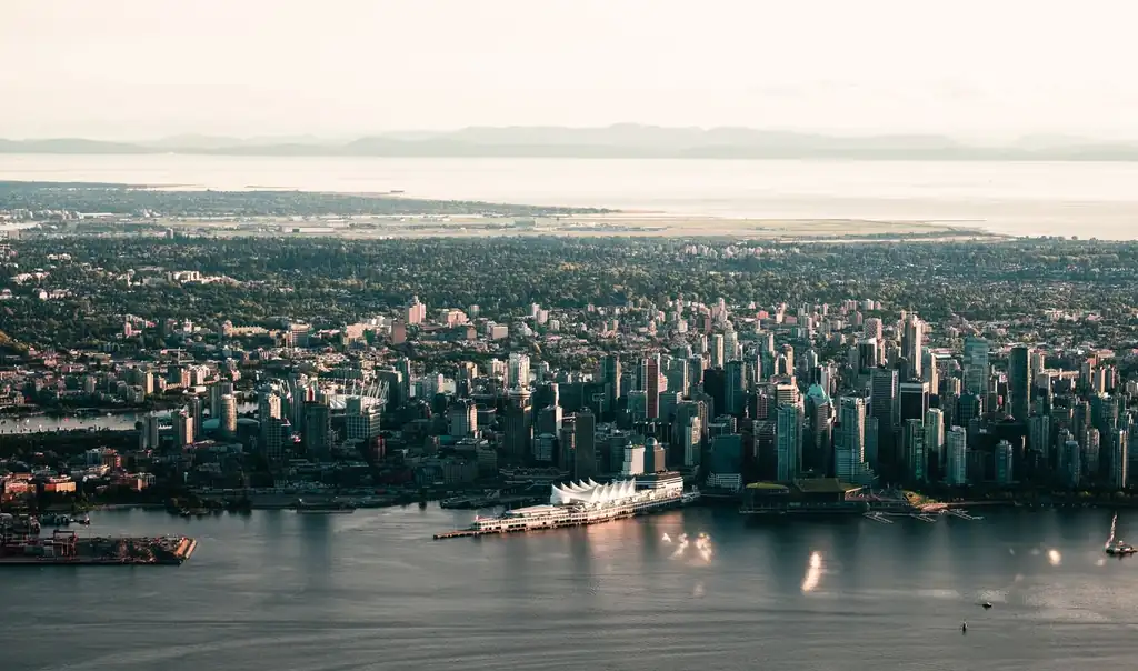 Scenic aerial view of Vancouver skyline with downtown waterfront and coastal mountains
