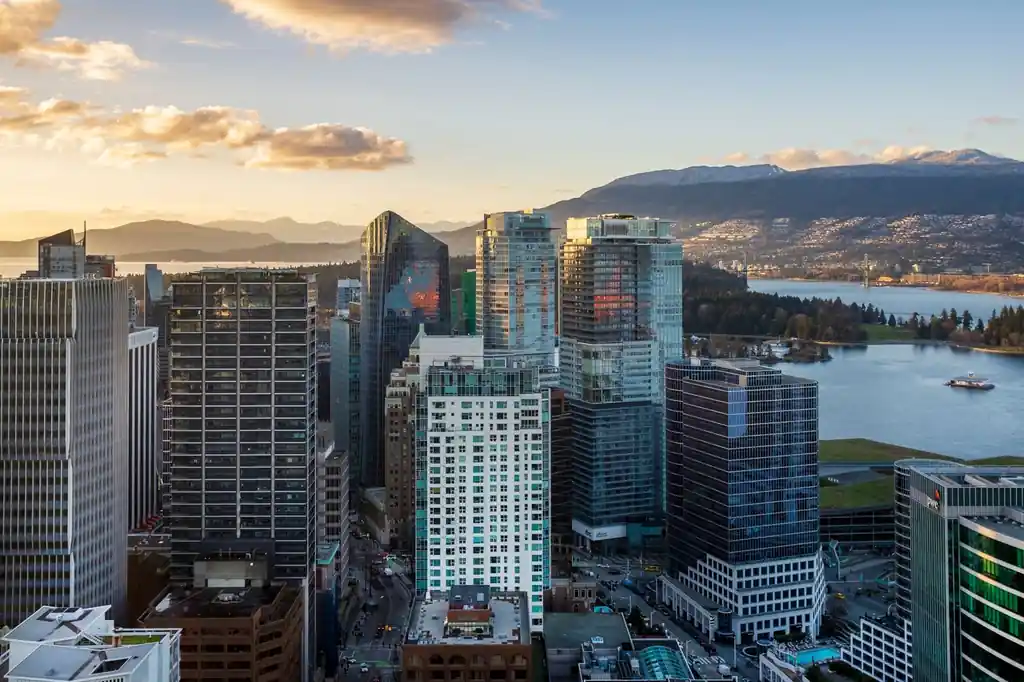 Vancouver skyline at sunset with coastal mountain silhouettes