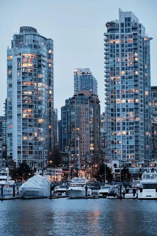 Yachts moored along the Vancouver marina with downtown skyline