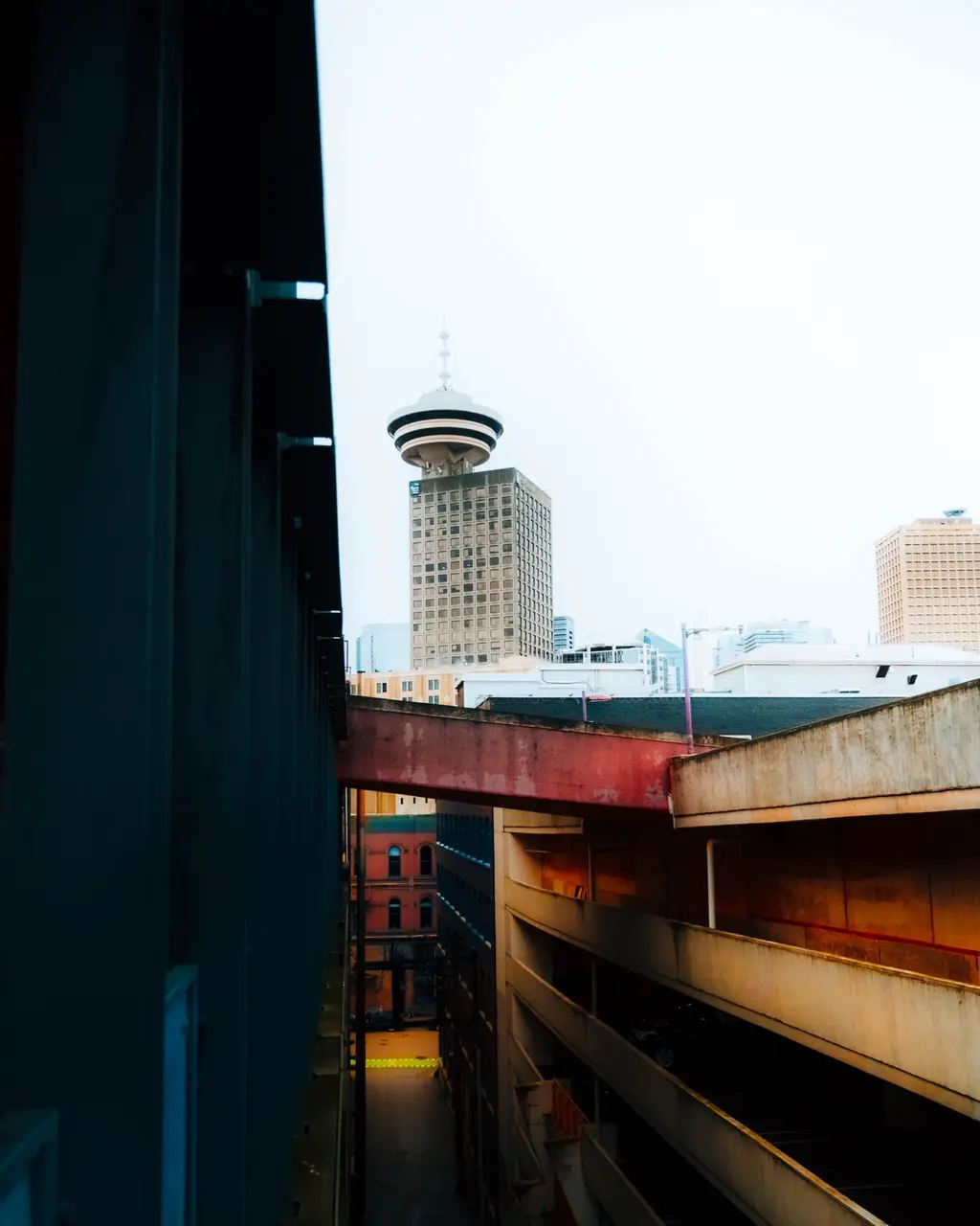 Architectural perspective of distinctive urban tower against dynamic coastal clouds