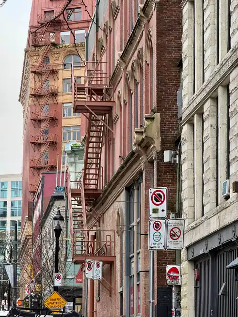 Charming view of historic brick buildings and fire escapes in Vancouver